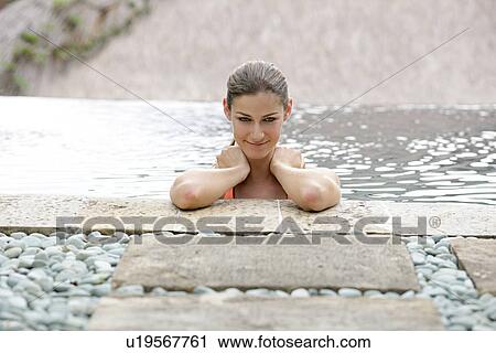 Close-up of a young woman smiling. View Large Photo Image Stock Image - Close-up of a young woman smiling.. Fotosearch