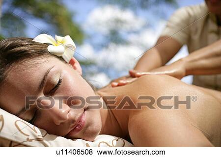 Close-up of a young woman taking massage. View Large Photo Image Stock Photo - Close-up of a young woman taking massage.. Fotosearch