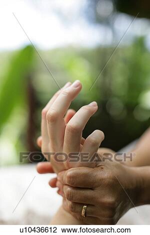 A massage therapist massaging hands. View Large Photo Image Stock Image - A massage therapist massaging hands.. Fotosearch