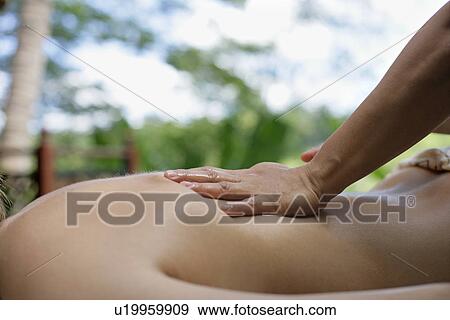 A person massaging a woman’s back. View Large Photo Image Stock Photo - A person massaging a woman’s back.. Fotosearch