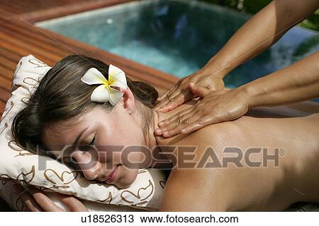 A person massaging a young woman’s back. View Large Photo Image Stock Image - A person massaging a young woman’s back.. Fotosearch