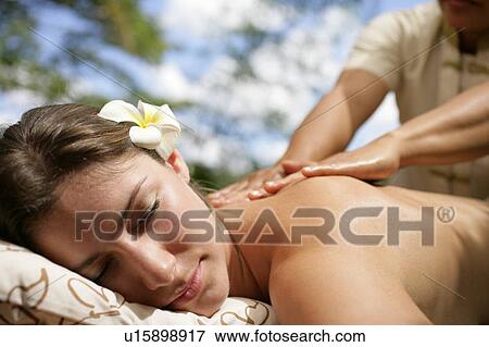 A person massaging a young woman’s back. View Large Photo Image Stock Photo - A person massaging a young woman’s back.. Fotosearch