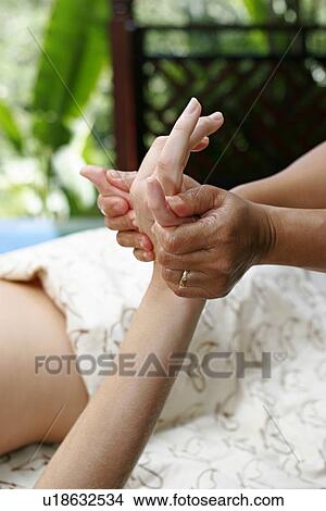A woman having massage by a massage therapist. View Large Photo Image Picture - A woman having massage by a massage therapist.. Fotosearch