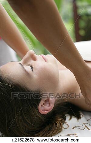 A woman having massage by a massage therapist. View Large Photo Image Stock Photo - A woman having massage by a massage therapist.. Fotosearch