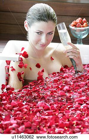 A young woman having aromatherapy bath with a drink. View Large Photo Image Stock Image - A young woman having aromatherapy bath with a drink.. Fotosearch