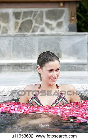 A young woman having aromatherapy bath. View Large Photo Image Stock Image - A young woman having aromatherapy bath.. Fotosearch