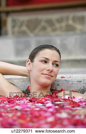 A young woman having aromatherapy bath. View Large Photo Image Stock Image - A young woman having aromatherapy bath.. Fotosearch