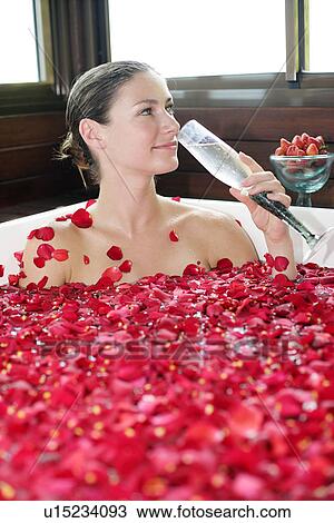 A young woman having aromatherapy bath with a drink. View Large Photo Image Stock Image - A young woman having aromatherapy bath with a drink.. Fotosearch