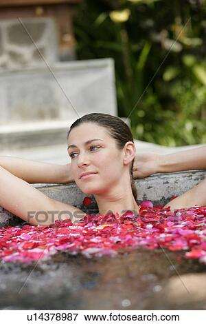 A young woman having aromatherapy bath. View Large Photo Image Stock Photo - A young woman having aromatherapy bath.. Fotosearch