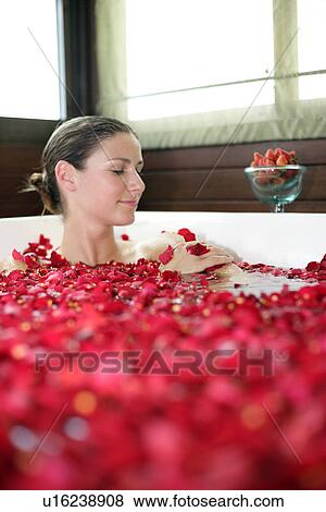 A young woman having aromatherapy bath. View Large Photo Image Stock Photo - A young woman having aromatherapy bath.. Fotosearch