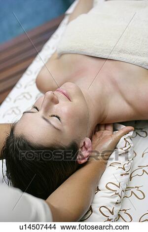 A young woman lying with eyes closed. View Large Photo Image Picture - A young woman lying with eyes closed.. Fotosearch