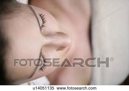 A young woman lying with eyes closed. View Large Photo Image Stock Photography - A young woman lying with eyes closed.. Fotosearch