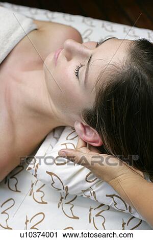 Close-up of a young woman having massage. View Large Photo Image Stock Image - Close-up of a young woman having massage.. Fotosearch