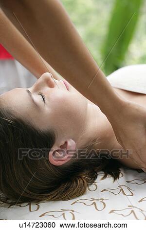 Stock Image - Close-up of a young woman having massage.. Fotosearch