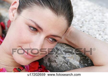 Close-up of a young woman having aromatherapy bath. View Large Photo Image Stock Photo - Close-up of a young woman having aromatherapy bath.. Fotosearch
