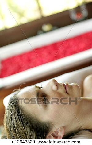 Stock Photo - Close-up of a young woman with eyes closed.. Fotosearch