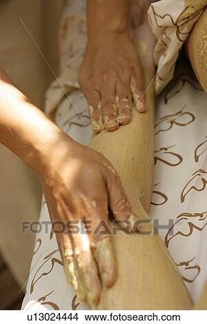 Close-up of hands of massage therapist applying alternative medicine. View Large Photo Image Picture - Close-up of hands of massage therapist applying alternative medicine.. Fotosearch