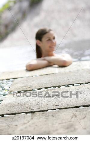 View of a young woman smiling. View Large Photo Image Picture - View of a young woman smiling.. Fotosearch