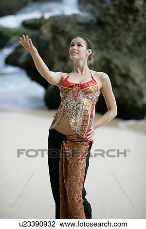 A woman performing on a beach. View Large Photo Image Stock Image - A woman performing on a beach.. Fotosearch