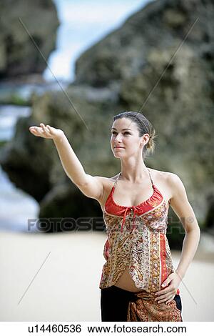 A woman performing on a beach. View Large Photo Image Stock Photograph - A woman performing on a beach.. Fotosearch
