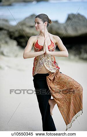 A woman standing with joined hands. View Large Photo Image Stock Photography - A woman standing with joined hands.. Fotosearch