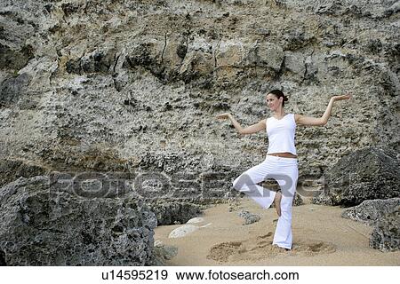 View of a woman exercising outdoor. View Large Photo Image Stock Photo - View of a woman exercising outdoor.. Fotosearch