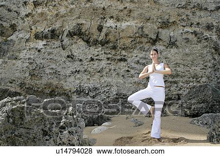 Stock Photo - View of a woman exercising outdoor.. Fotosearch