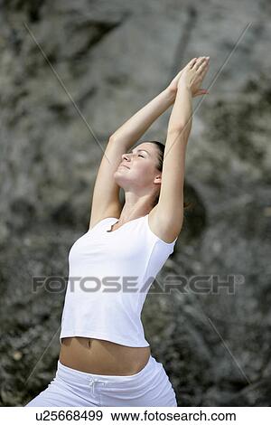 View of a woman exercising outdoor. View Large Photo Image Stock Photo - View of a woman exercising outdoor.. Fotosearch