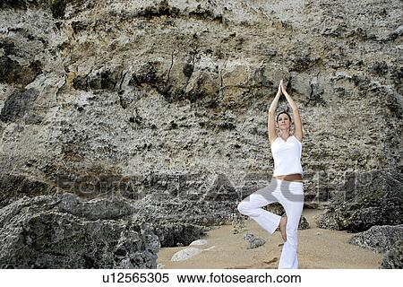 Stock Photography - View of a woman exercising outdoor.. Fotosearch