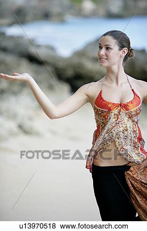 View of a woman standing with arm out. View Large Photo Image Stock Photo - View of a woman standing with arm out.. Fotosearch