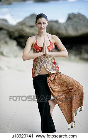 View of a woman standing with joined hands. View Large Photo Image Stock Image - View of a woman standing with joined hands.. Fotosearch