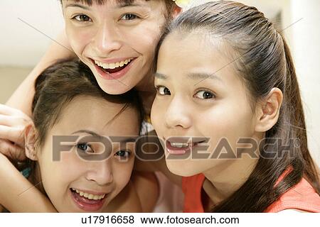 Close-up of young women smiling. View Large Photo Image Stock Photo - Close-up of young women smiling.. Fotosearch