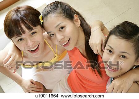 Portrait of young women smiling. View Large Photo Image Picture - Portrait of young women smiling.. Fotosearch