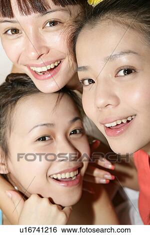 Portrait of young women smiling. View Large Photo Image Stock Photograph - Portrait of young women smiling.. Fotosearch