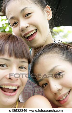 Portrait of young women smiling. View Large Photo Image Stock Photograph - Portrait of young women smiling.. Fotosearch