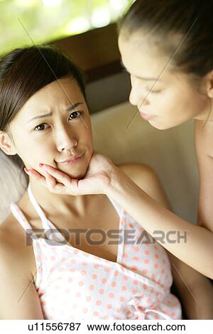 View of a woman pampering other. View Large Photo Image Stock Photo - View of a woman pampering other.. Fotosearch