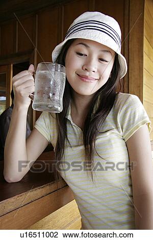 View of a young woman drinking water. View Large Photo Image Stock Image - View of a young woman drinking water.. Fotosearch