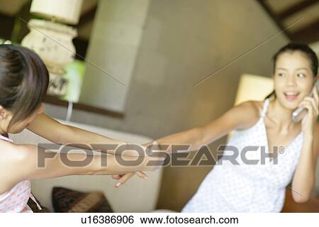 View of playful young women. View Large Photo Image Stock Photograph - View of playful young women.. Fotosearch