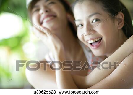 View of young women hugging. View Large Photo Image Stock Image - View of young women hugging.. Fotosearch