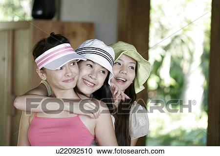 View of young women standing in row and smiling. View Large Photo Image Stock Image - View of young women standing in row and smiling.. Fotosearch