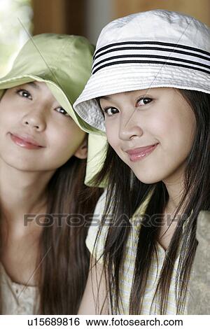 Stock Photograph - View of young women staring.. Fotosearch