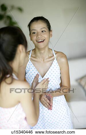 View of young women talking. View Large Photo Image Stock Photograph - View of young women talking.. Fotosearch