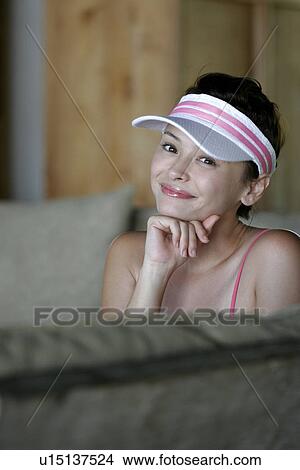 Picture - Portrait of a young woman smiling.. Fotosearch