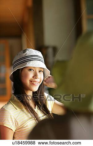 Stock Photo - Portrait of a young woman.. Fotosearch