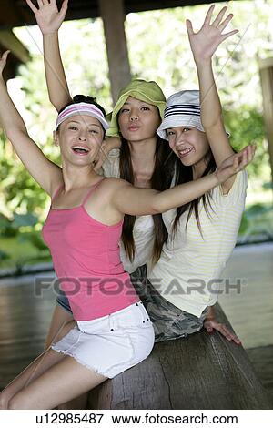 Stock Photo - Portrait of young women shouting.. Fotosearch