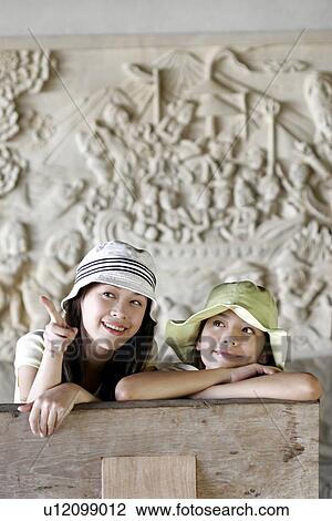 Stock Image - Portrait of young women.. Fotosearch