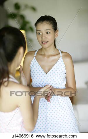 View of young women talking. View Large Photo Image Stock Photograph - View of young women talking.. Fotosearch