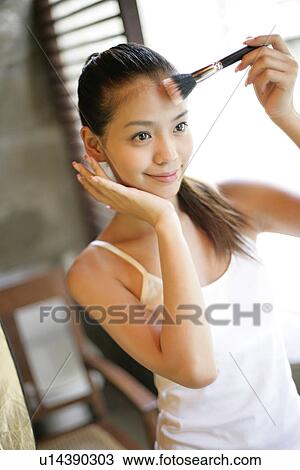 View of a woman with a brush in her hand. View Large Photo Image Stock Image - View of a woman with a brush in her hand.. Fotosearch