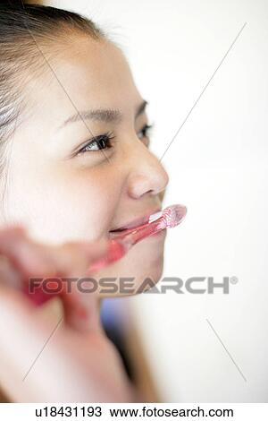 Woman brushing her teeth. View Large Photo Image Stock Image - Woman brushing her teeth.. Fotosearch