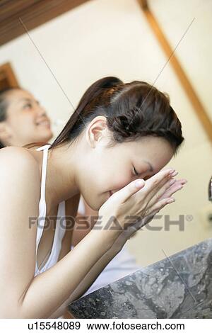 Woman washing her face. View Large Photo Image Stock Photo - Woman washing her face.. Fotosearch